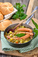 Deftiger Erbseneintopf mit Kartoffeln, Speck und Wiener Würstchen  - Hearty pea stew with potatoes, bacon and Viennese sausages