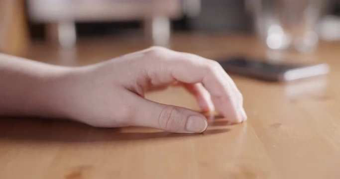 female teen nervous hand finger tapping closeup, ProRes footage shot in 60fps