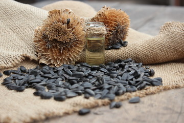 Dry flower sunflower seeds and  oil from the jar