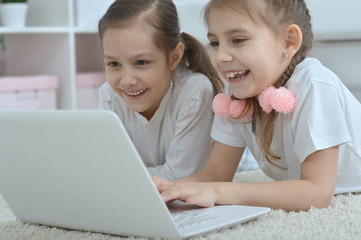 little girls looking at laptop