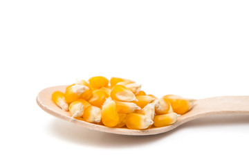 corn in a wooden spoon isolated