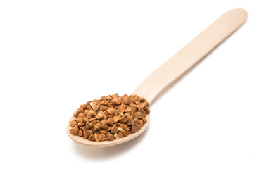 Buckwheat in a wooden spoon