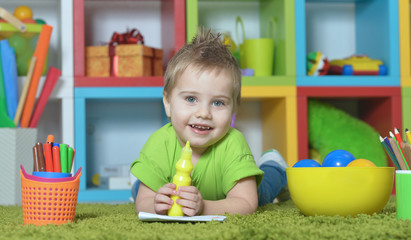little boy playing with toy