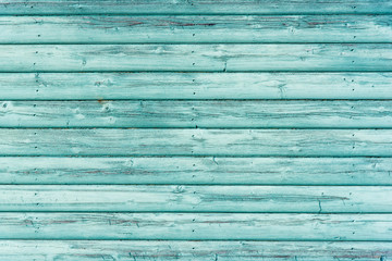 Textured green coloured wooden panelling from a beach hut.  Suitable for background etc.