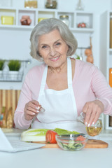 Senior woman cooking in kitchen