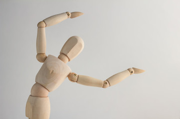 Wooden figure showing up blank space on white background