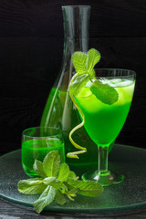Drink with tarragon and mint, cocktail with ice 
