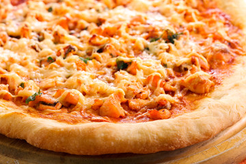 Salmon and herb pizza on board