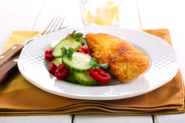 Fried chicken breast and salad