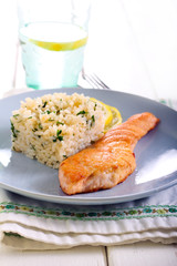 Fried piece of salmon and rice