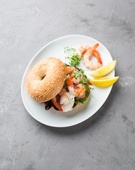 Bagel with shrimp and radish