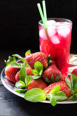 Refreshing drink with strawberries and ice
