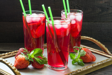 Refreshing drink with strawberries and ice