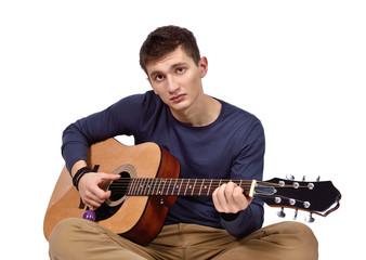 Obraz premium young man with acoustic guitar