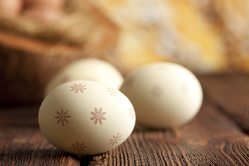 White Easter eggs on wooden table