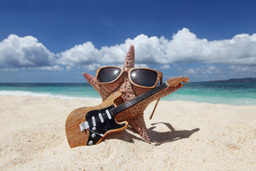 Starfish guitar player on beach