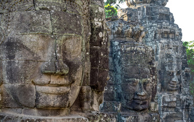 Fototapeta na wymiar Smiling face from the Bayon Temple, Ankor Thom, Cambodia