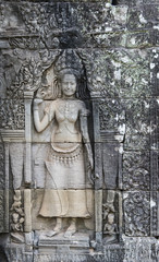 Fototapeta na wymiar Statue of a female figure, Ankhor Thom, Cambodia