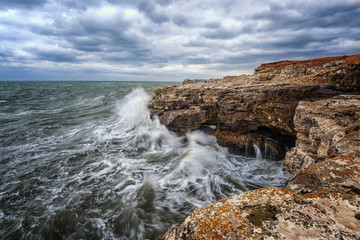 Dramatic seascape with rocks and waves