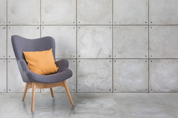 modern wooden chair and concrete wall