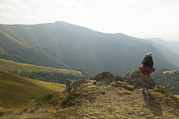 Fototapeta premium Girl taking photo in mountains