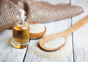 Sesame seeds and bottle with oil
