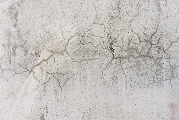 white dirty wall with cracks as background