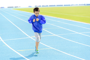 Boy run in blue track