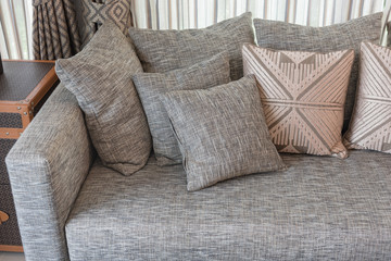 modern grey sofa with pillows
