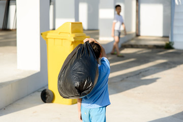 Boy carry garbage
