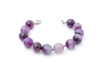 Bracelet with purple beads isolated
