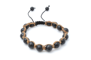 Naklejka premium Bracelet with black beads isolated