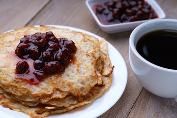 Pancakes with jam and coffee