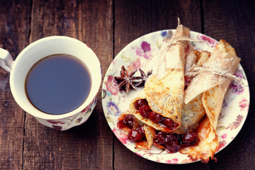 Pancakes with jam and coffee