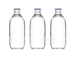 three small glass water bottle