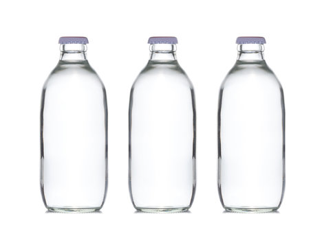 three small glass water bottle