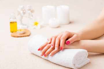 Obraz na płótnie Canvas Woman is spa salon with her nails done