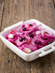 Red onion pickled with black currant.