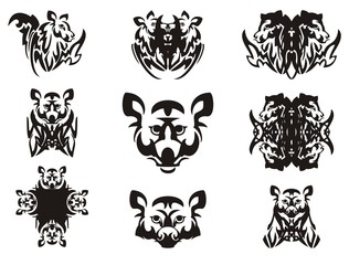 Imaginary animal head and symbols from it. Tribal imaginary head of an animal with wings, the head of a raccoon, a cross and other double symbols