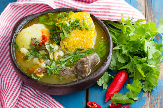 Latin american food. Cazuela - traditional chilean soup served in clay plate from pomaire