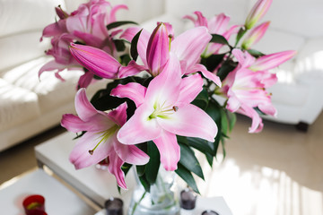 Bouquet of pink lilies in a glass vase