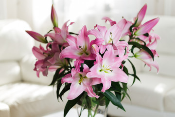 Bouquet of pink lilies in a glass vase
