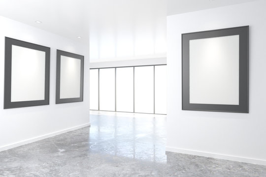 Empty bright art gallery with blank pictures on the walls, mock