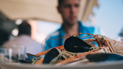 Pasta Frutti Di Mare on the plate in the restaurant