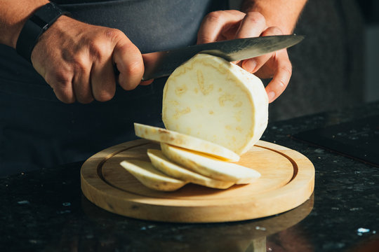 cooking on the kitchen and slicing celery root