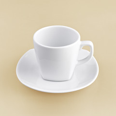 white cup on orange background