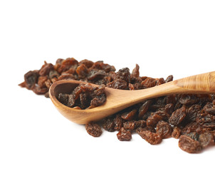 Wooden spoon over the pile of raisins
