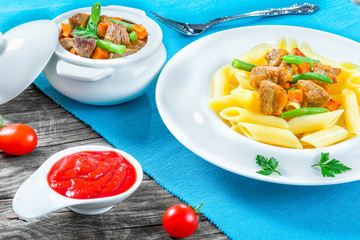 italian pasta penne and stewed meat