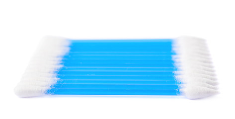 Row of multiple cotton swabs isolated