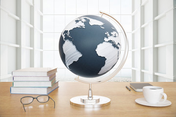 Globe and coffee on desktop